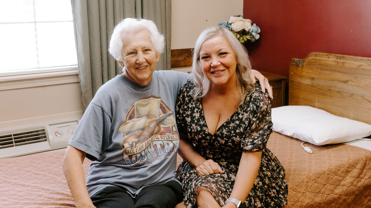 Elder with Visitor at Highland Court Rehabilitation and Resident Center